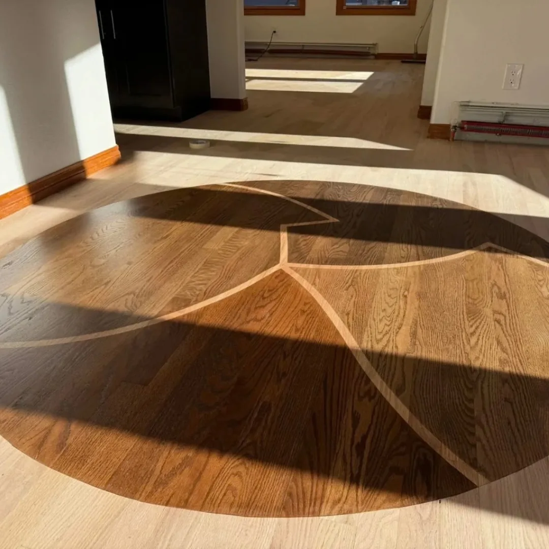 Custom dark and light hardwood floor design.