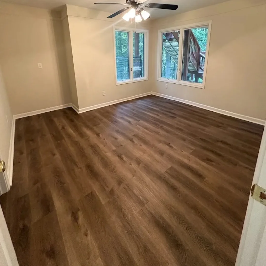 Newly installed hardwood floors in an empty room