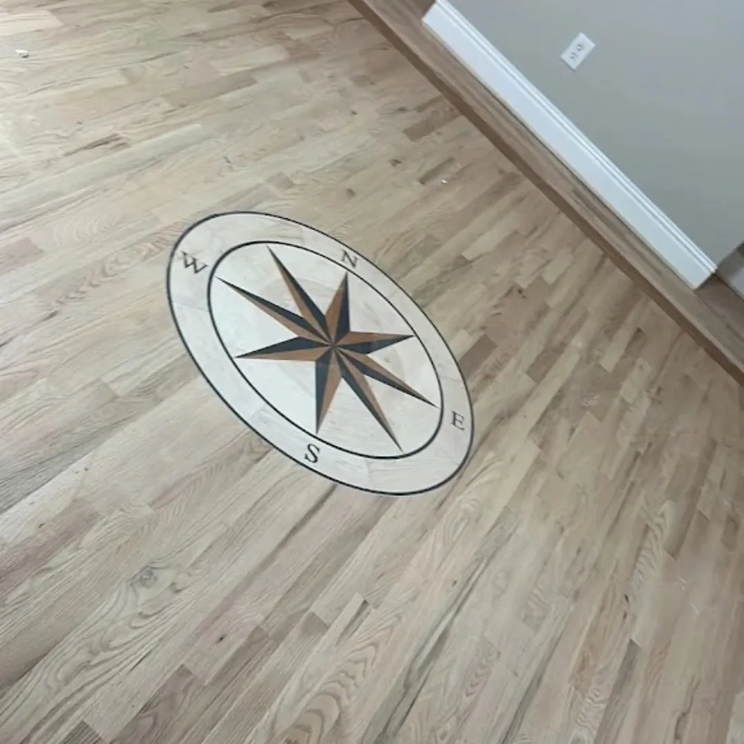 Hardwood floor with compass rose inlay.