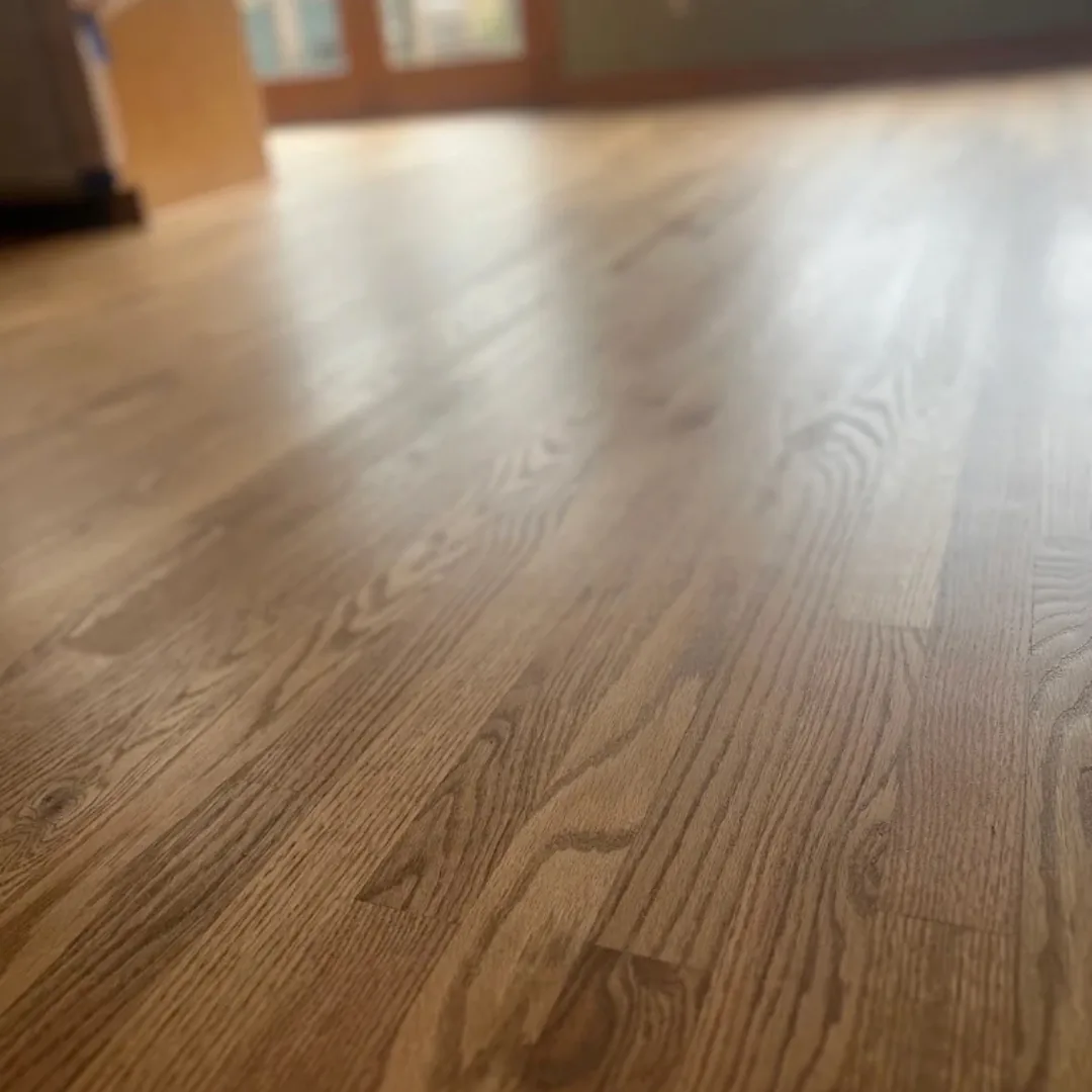 Refinished hardwood floor with natural wood grain visible