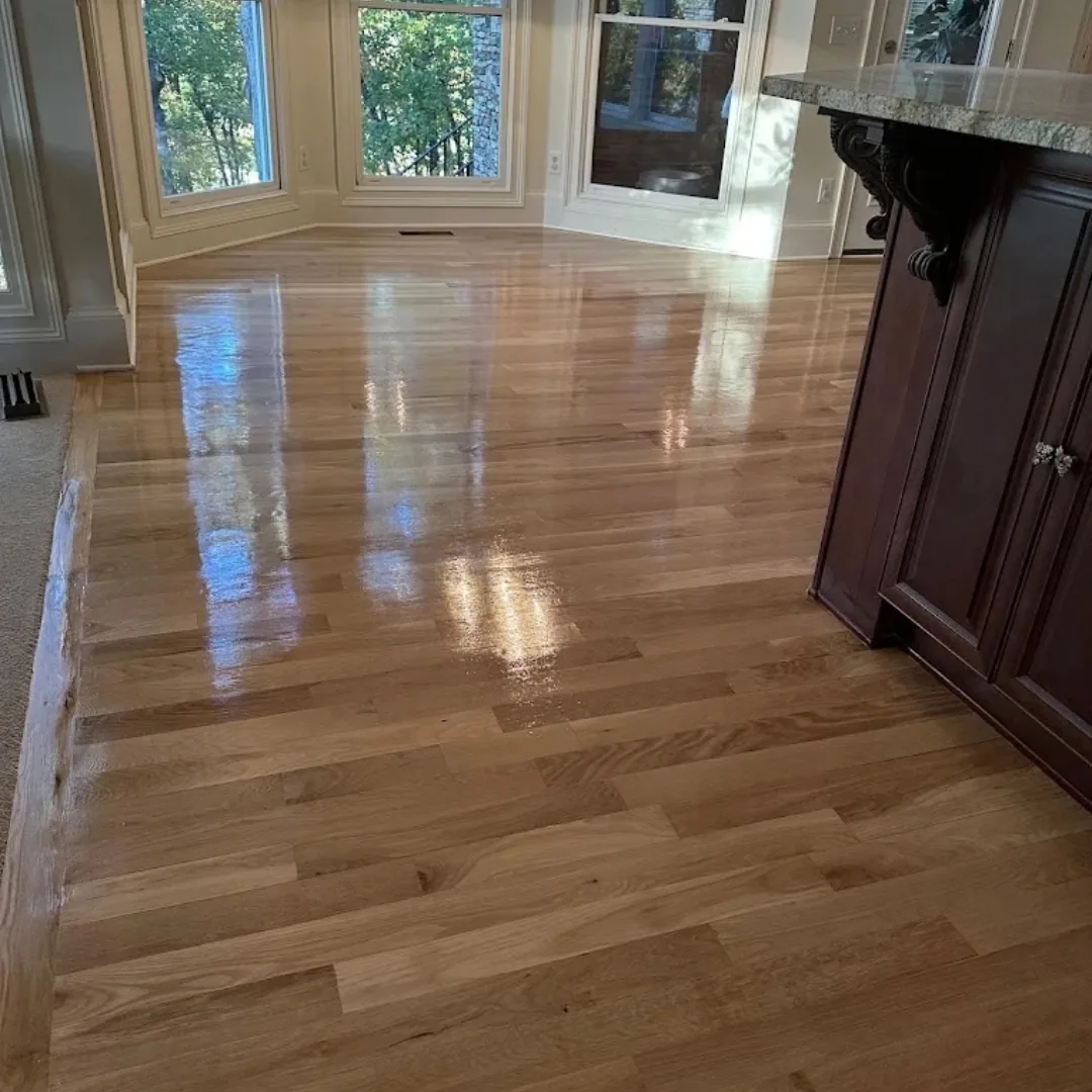 Newly refinished hardwood floors with a high gloss finish.