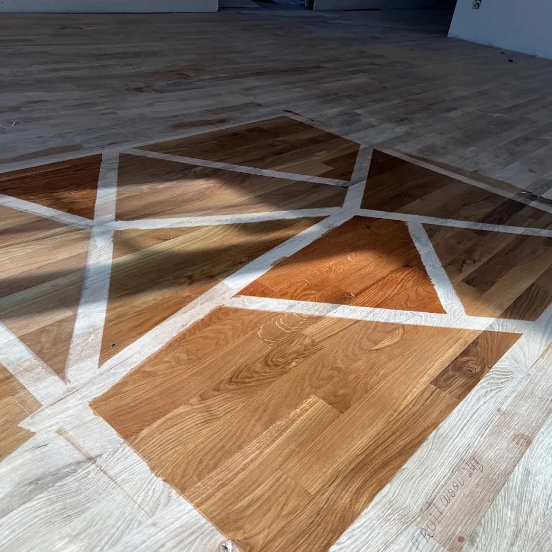 Hardwood floor refinishing with geometric design