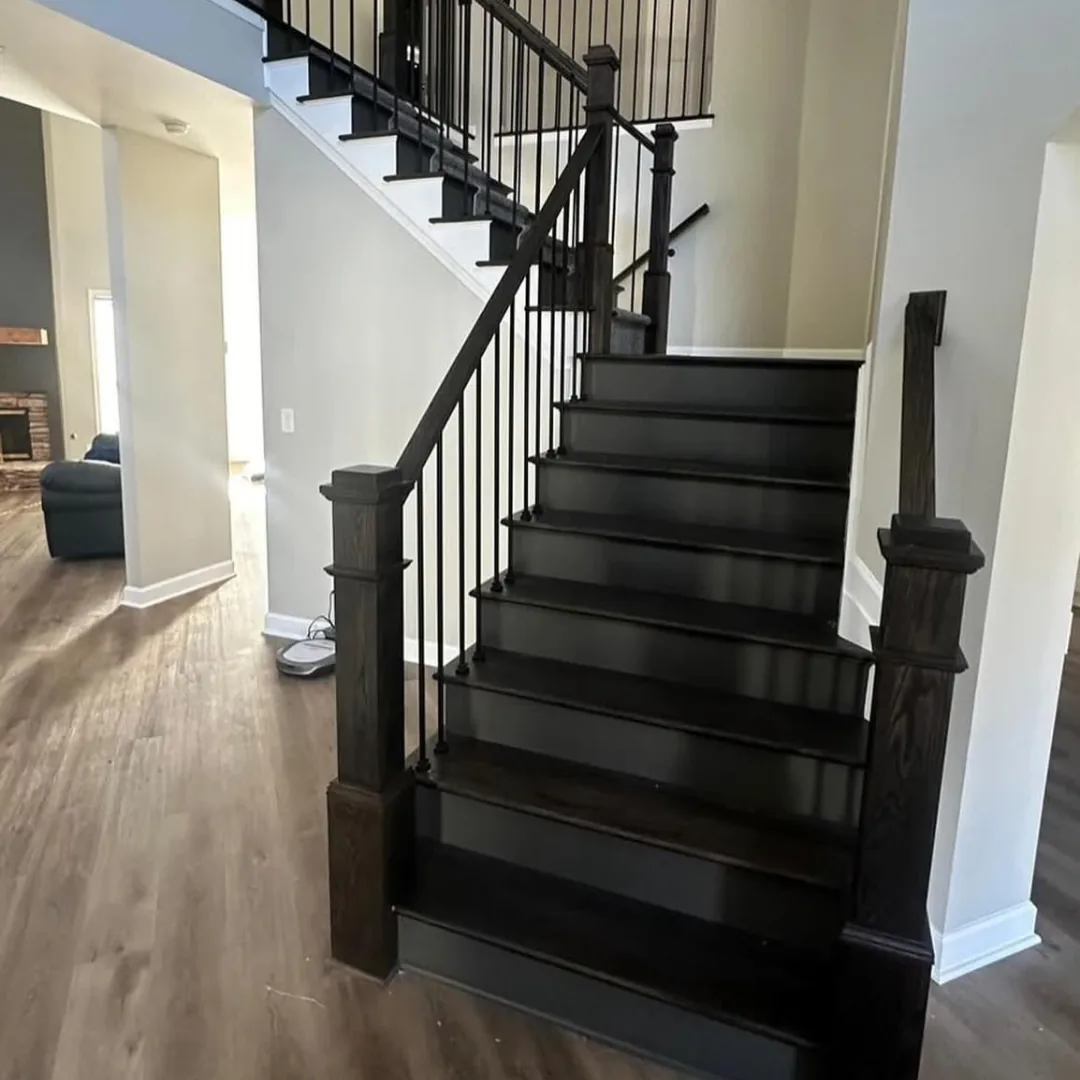 Newly installed dark wood staircase with railing