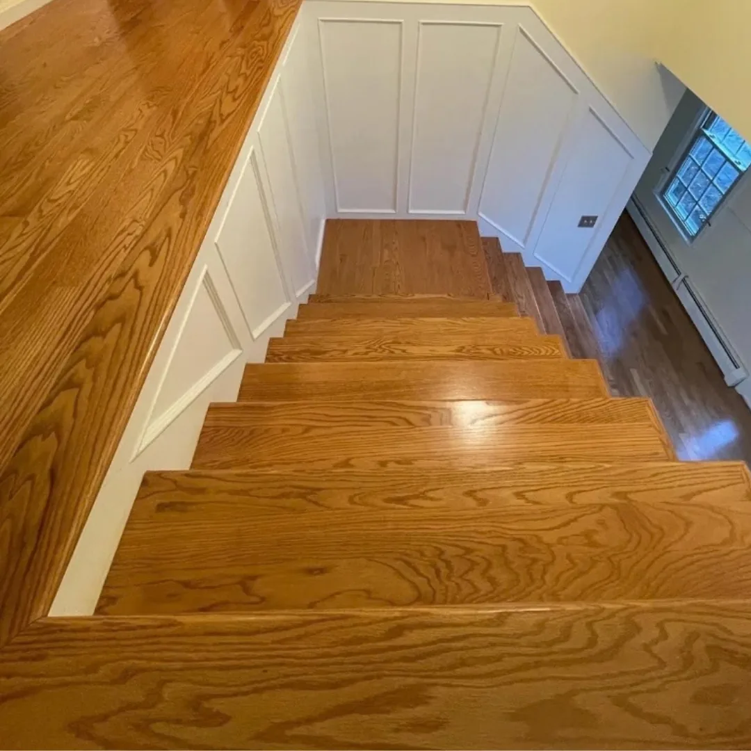 Newly refinished hardwood stairs and landing.