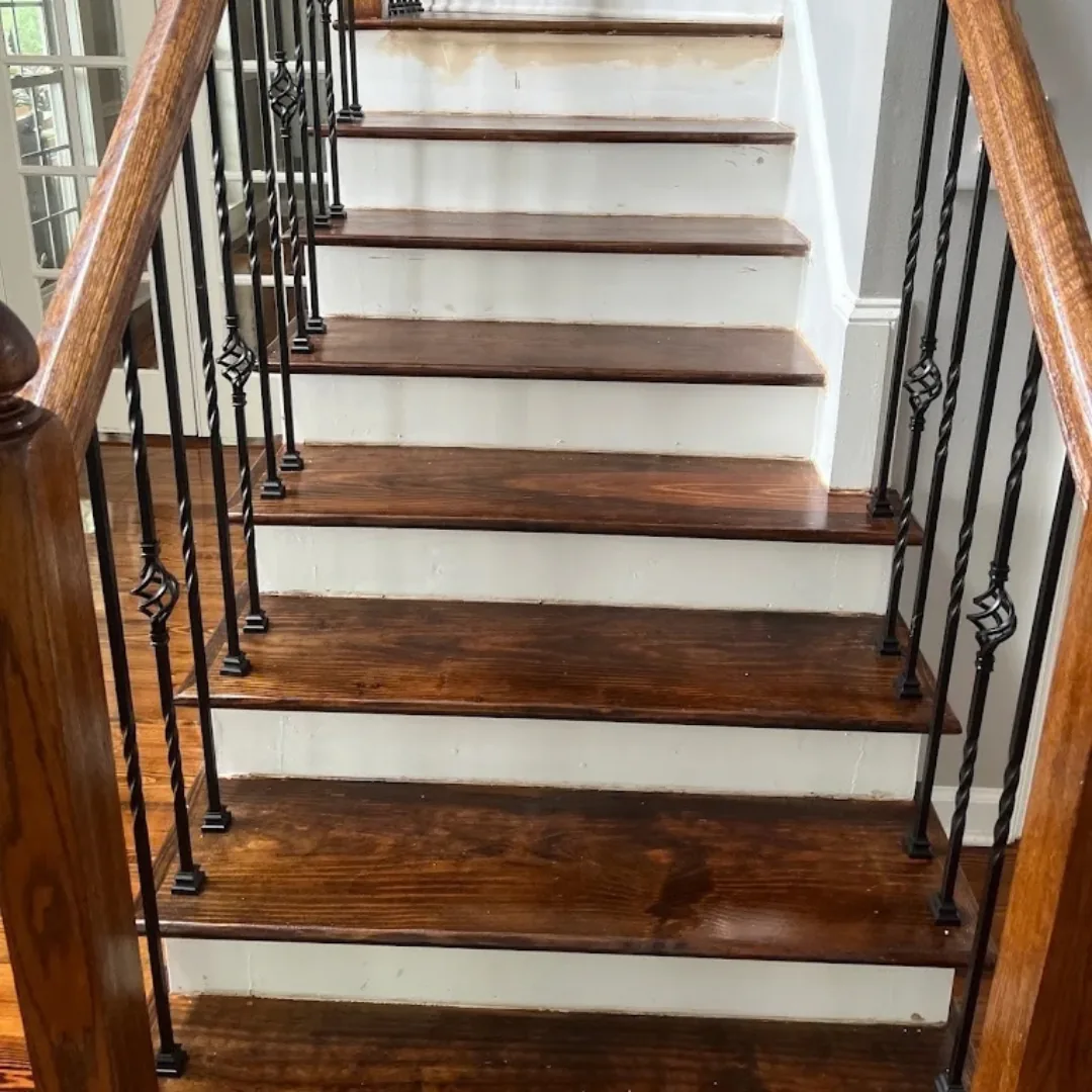 Staircase with dark wood treads and white risers.