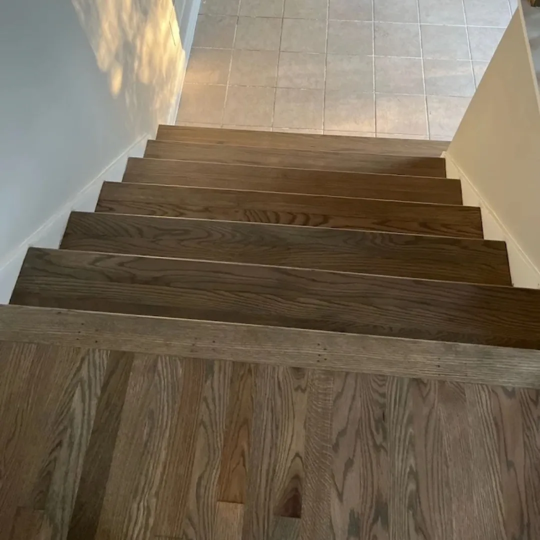 Newly installed hardwood stairs and landing