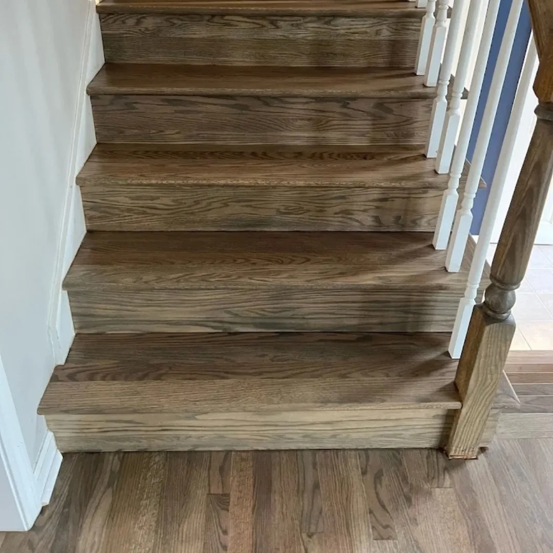 Newly refinished hardwood stairs and flooring